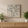 A black and white wood wall art featuring a detailed line art design of leaves.